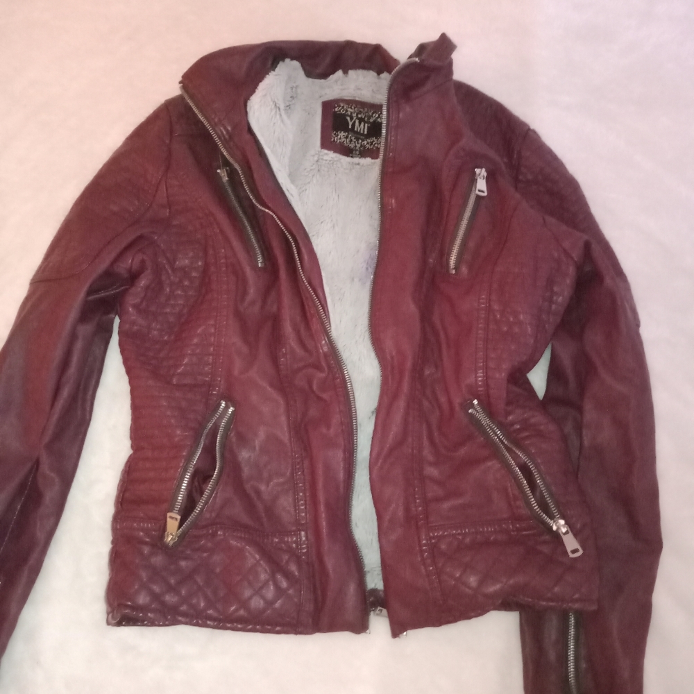 Burgundy jacket with fur inside.
